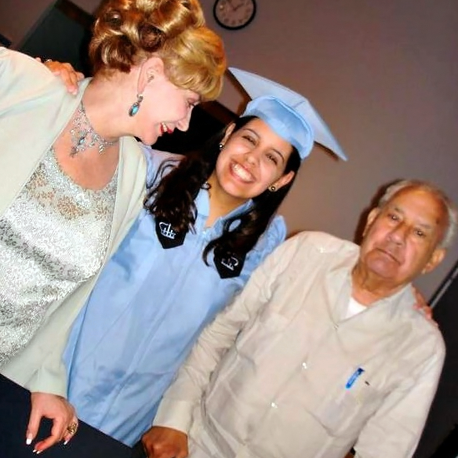 Carmen Cusido with her parents at her graduation