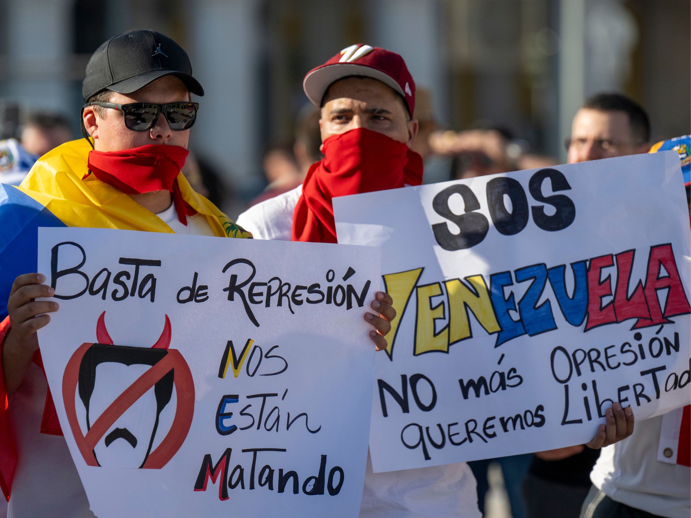 Demonstrators are seen holding banners and Venezuelan flags during a rally in Praca de Comercio in Lisbon, Portugal, on August 04, 2024. Venezuelans and supporters of Maria Corina Machado are rallying in the center of Lisbon to reject the electoral fraud of the last presidential elections, where the current president Nicolas Maduro Moros was re-elected. The demonstration is also aimed at supporting the freedom of Venezuela. (Photo by Jorge Mantilla/NurPhoto via Getty Images)