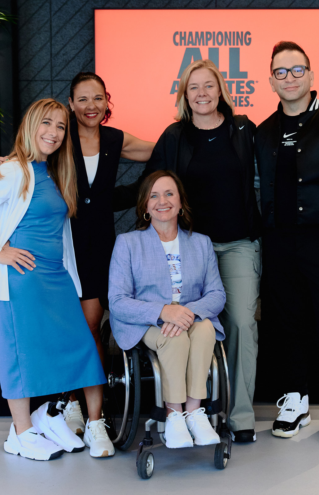 Nike and the USOPC announced the GameOn program at an event in Paris. From left to right, Sarah Reinertsen, Paralympian and Nike Lead Professional, Sports Marketing; Vanessa Garcia-Brito, Nike Chief Impact Officer; Sarah Hirshland, CEO, U.S. Olympic & Paralympic Committee; James Loduca, Nike Vice President, Diversity, Equity, Inclusion; seated is Dr. Cheri Blauwet, Paralympian and Sports Medicine Physician, Professor at Harvard Medical School, and Chief Medical Officer of Spaulding Rehabilitation/Mass General Brigham.