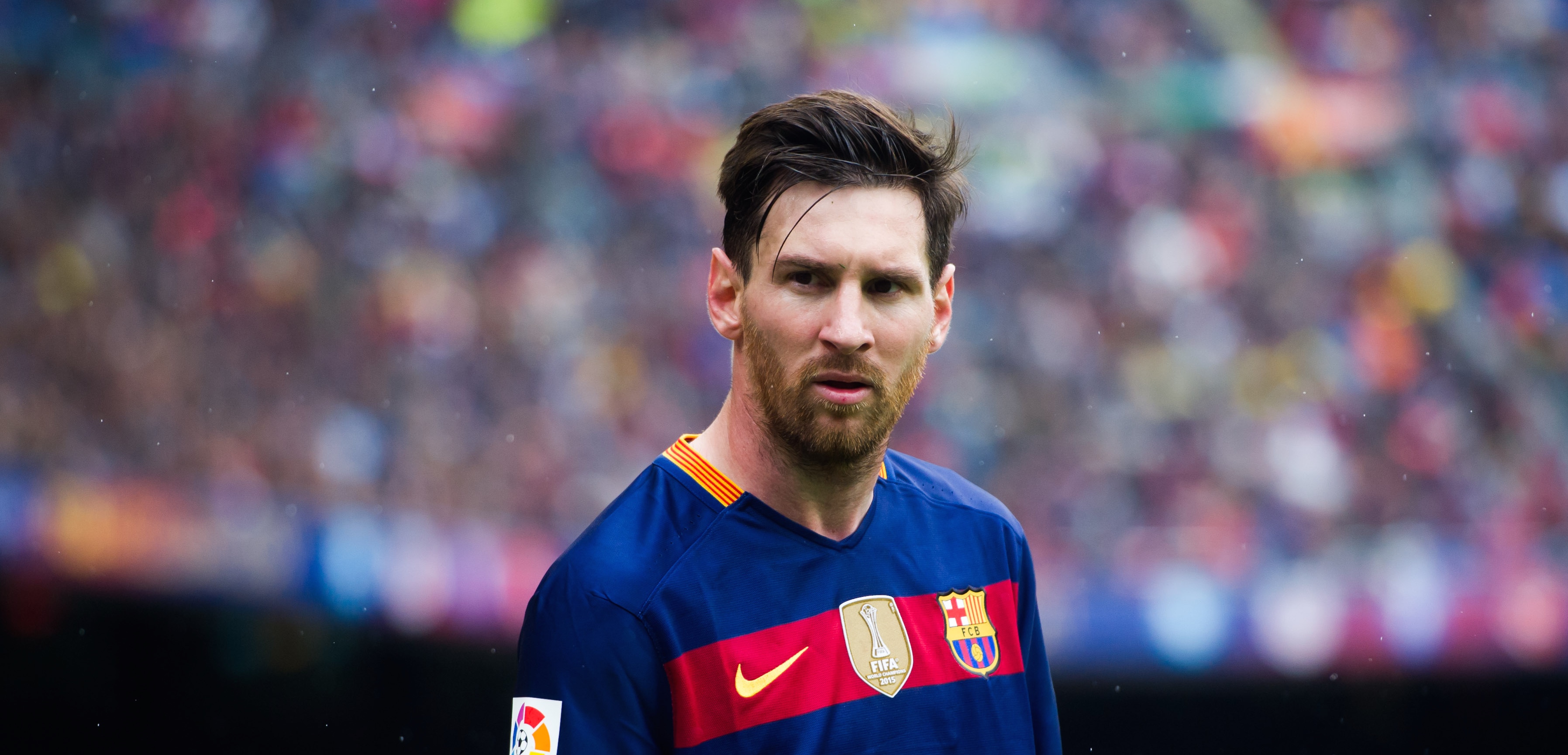 Lionel Messi looks on during a La Liga match between FC Barcelona and RCD Espanyol. Photo by Alex Caparros/Getty Images