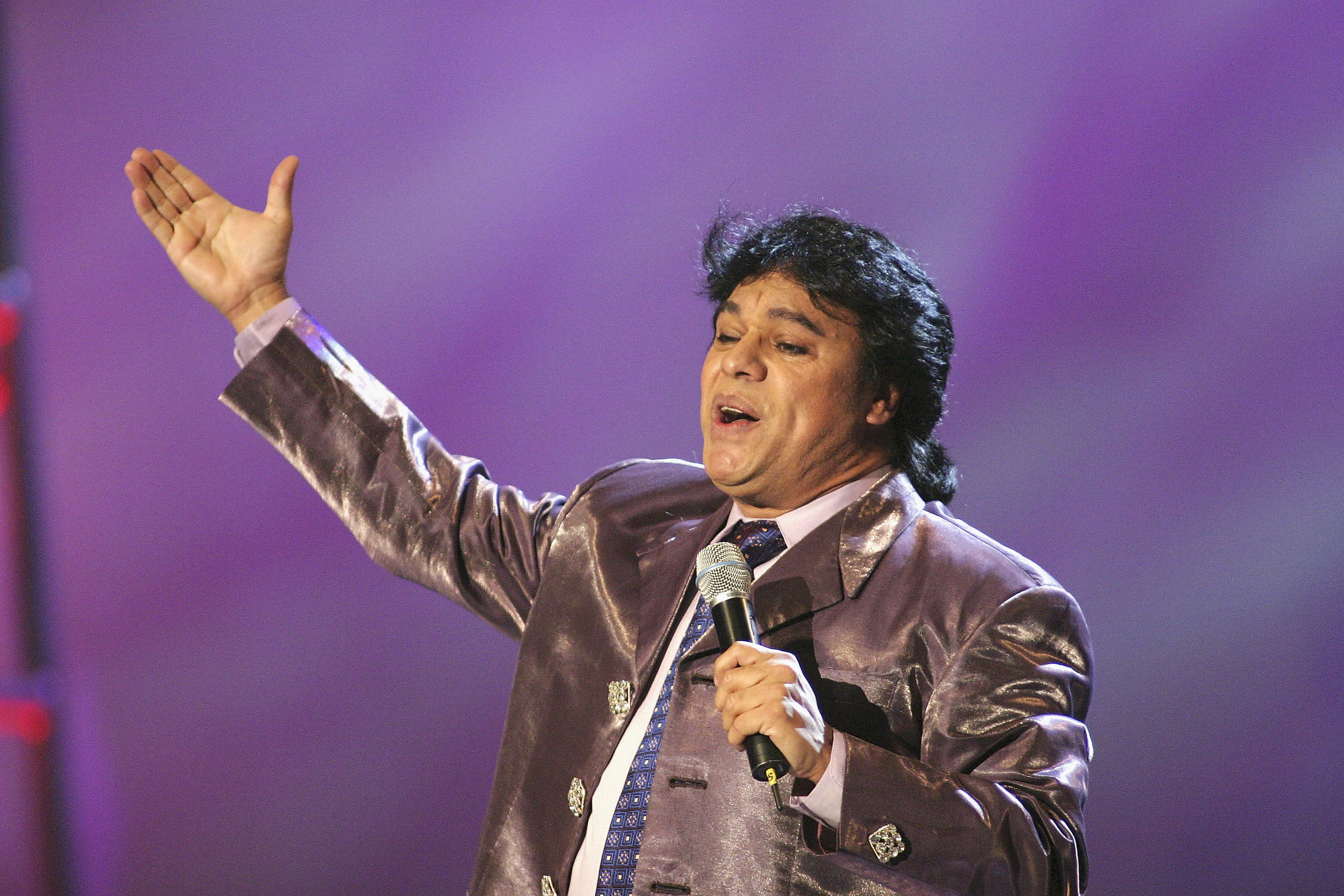 Juan Gabriel performs at the 2003 Latin Music Fan Awards Photo by Giulio Marcocchi /Getty Images