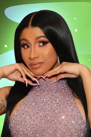Cardi B posing with hands on chin.