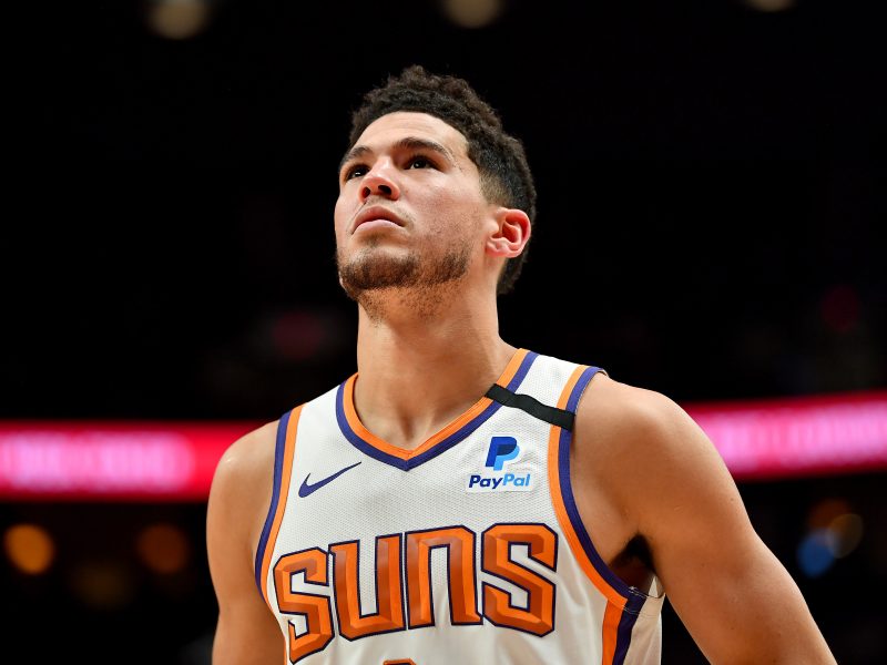 Devin Booker #1 of the Phoenix Suns looks on during the first half of the game against the Portland Trail Blazers at the Moda Center on March 10, 2020 in Portland, Oregon. Photo by Alika Jenner/Getty Images