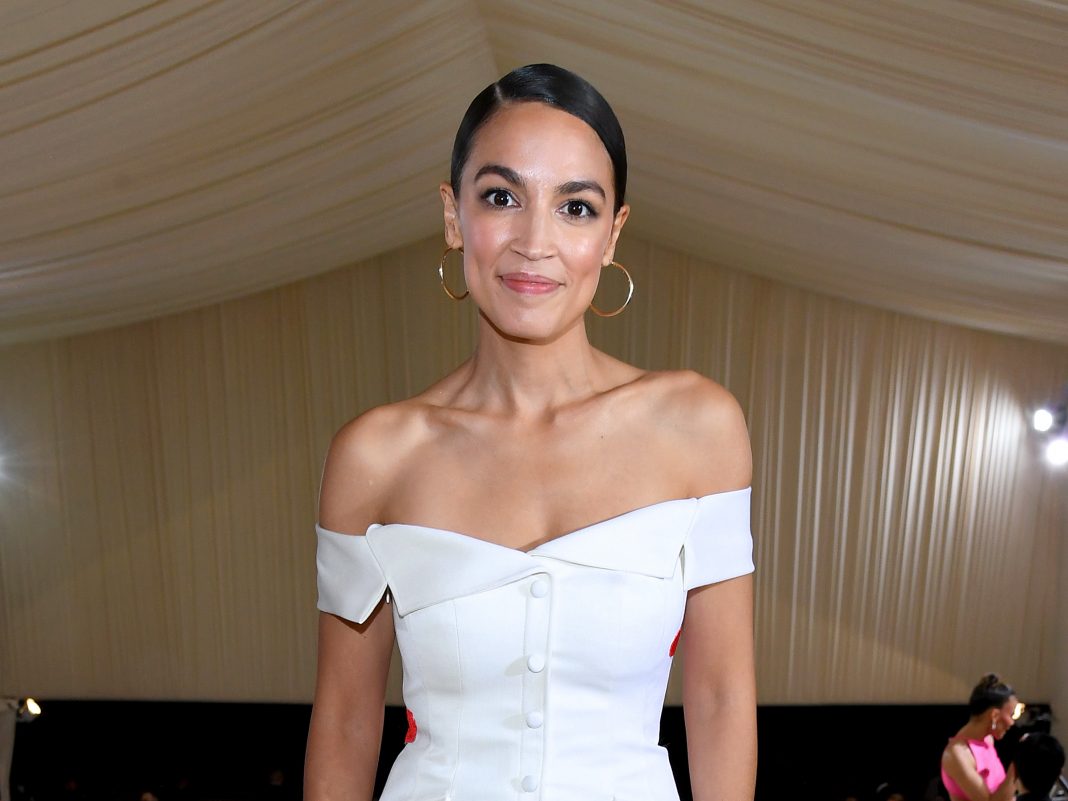 Alexandria Ocasio Cortez Wears Tax The Rich Gown To 2021 Met Gala