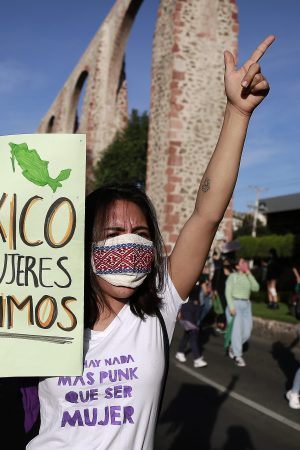 A woman holds up a sign that reads "In Mexico, we women decide" during a demonstration in favor of decriminalization of abortion on the International Safe Abortion Day on September 28, 2020 in Queretaro, Mexico.
