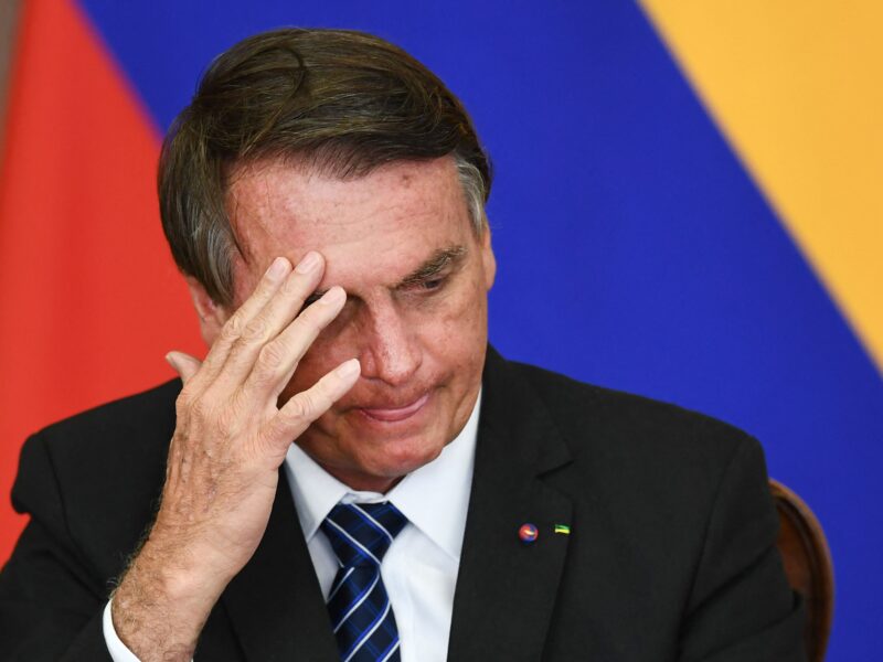 TOPSHOT - Brazilian President Jair Bolsonaro gestures during the signing of agreements with his Colombian counterpart Ivan Duque (out of frame) at Planalto Palace in Brasilia, on October 19, 2021. - Duque is on 2-day official visit to Brazil.