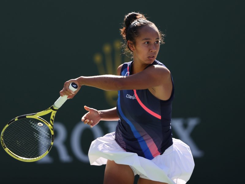 INDIAN WELLS, CALIFORNIA - OCTOBER 12: Leylah Fernandez of Canada plays a forehand against Shelby Rogers of the United States during fourth round match on Day 9 of the BNP Paribas Open at the Indian Wells Tennis Garden on October 12, 2021 in Indian Wells, California.