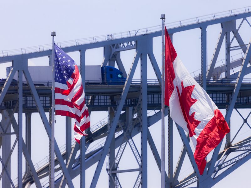 Sarnia, Canada - June 12, 2017. Trucks and cars make their way across the Blue Water Bridge in Sarnia Canada. Opened in 1938 the bridge connects Canada to the United States.