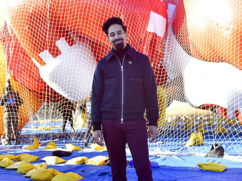 NEW YORK, NEW YORK - NOVEMBER 13: Vice President, Executive Producer of Macy's Branded Entertainment, Will Coss poses in front of the new balloons Macy's unveils them for the 95th Annual Macy's Thanksgiving Day Parade® on November 13, 2021 in New York City.
