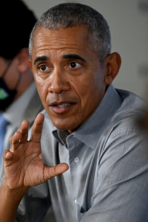 GLASGOW, SCOTLAND - NOVEMBER 08: Former US President Barack Obama gestures as he speaks during a round table meeting at the University of Strathclyde on November 08, 2021 in Glasgow, Scotland. Day Nine of the 2021 climate summit in Glasgow will focus on delivering the practical solutions needed to adapt to climate impacts and address loss and damage. This is the 26th "Conference of the Parties" and represents a gathering of all the countries signed on to the U.N. Framework Convention on Climate Change and the Paris Climate Agreement. The aim of this year's conference is to commit countries to net-zero carbon emissions by 2050.