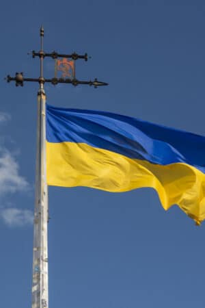 Ukrainian flag with the The coat of arms of the city Lviv,Ukraine for post about Latin American countries speaking in support of Ukraine.