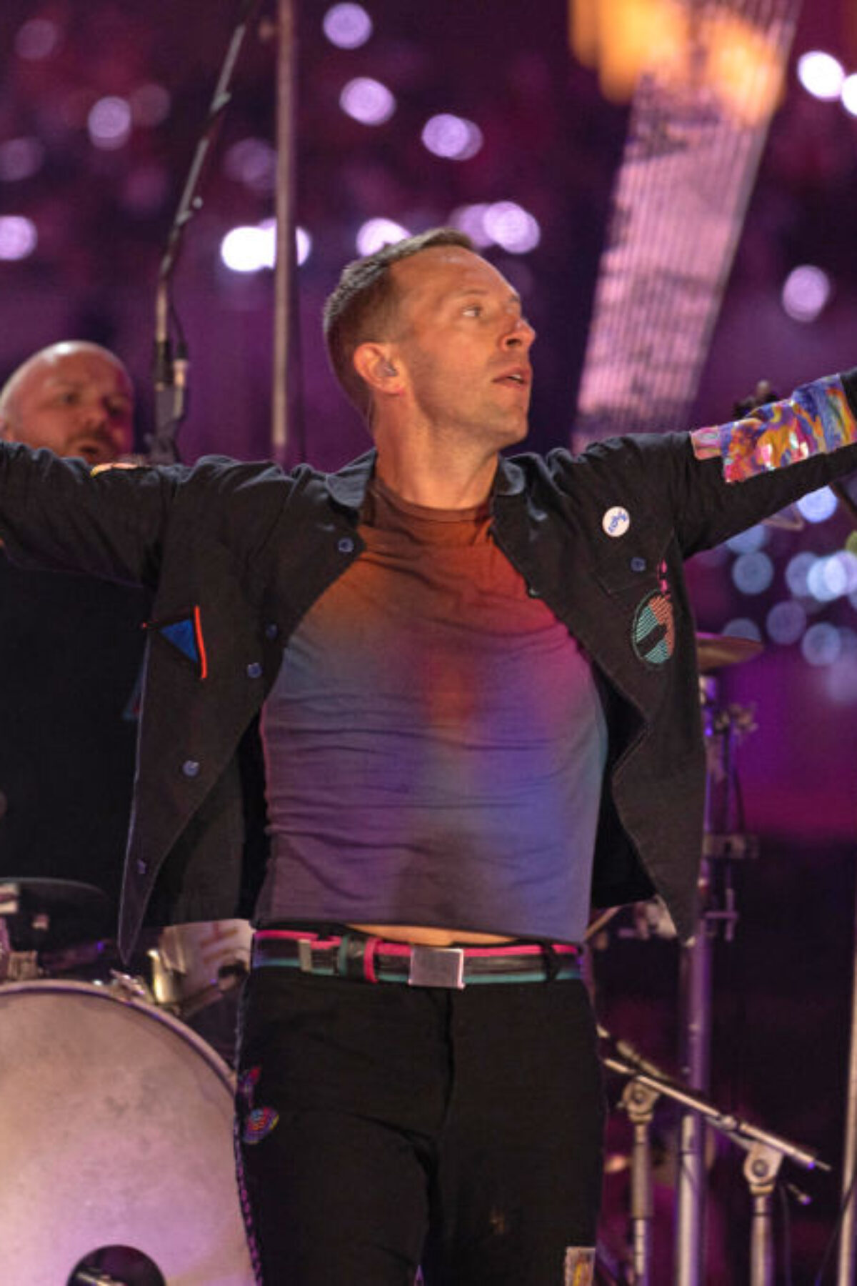 DUBAI, UNITED ARAB EMIRATES - FEBRUARY 15: Will Champion and Chris Martin of Coldplay perform live on stage at Al Wasl Plaza on February 15, 2022 in Dubai, United Arab Emirates. (Photo by Shlomi Pinto/Getty Images)