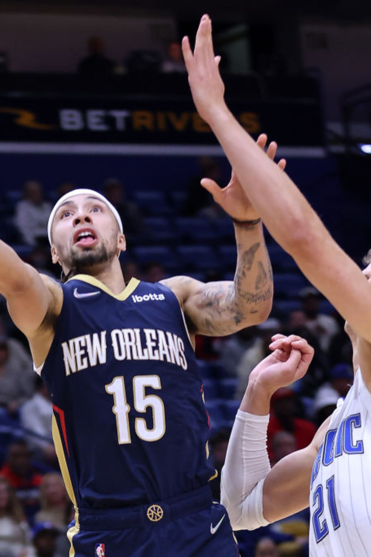 NEW ORLEANS, LOUISIANA - MARCH 09: Jose Alvarado #15 of the New Orleans Pelicans shoots against Moritz Wagner #21 of the Orlando Magic during the second half at the Smoothie King Center on March 09, 2022 in New Orleans, Louisiana. NOTE TO USER: User expressly acknowledges and agrees that, by downloading and or using this Photograph, user is consenting to the terms and conditions of the Getty Images License Agreement. (Photo by Jonathan Bachman/Getty Images)