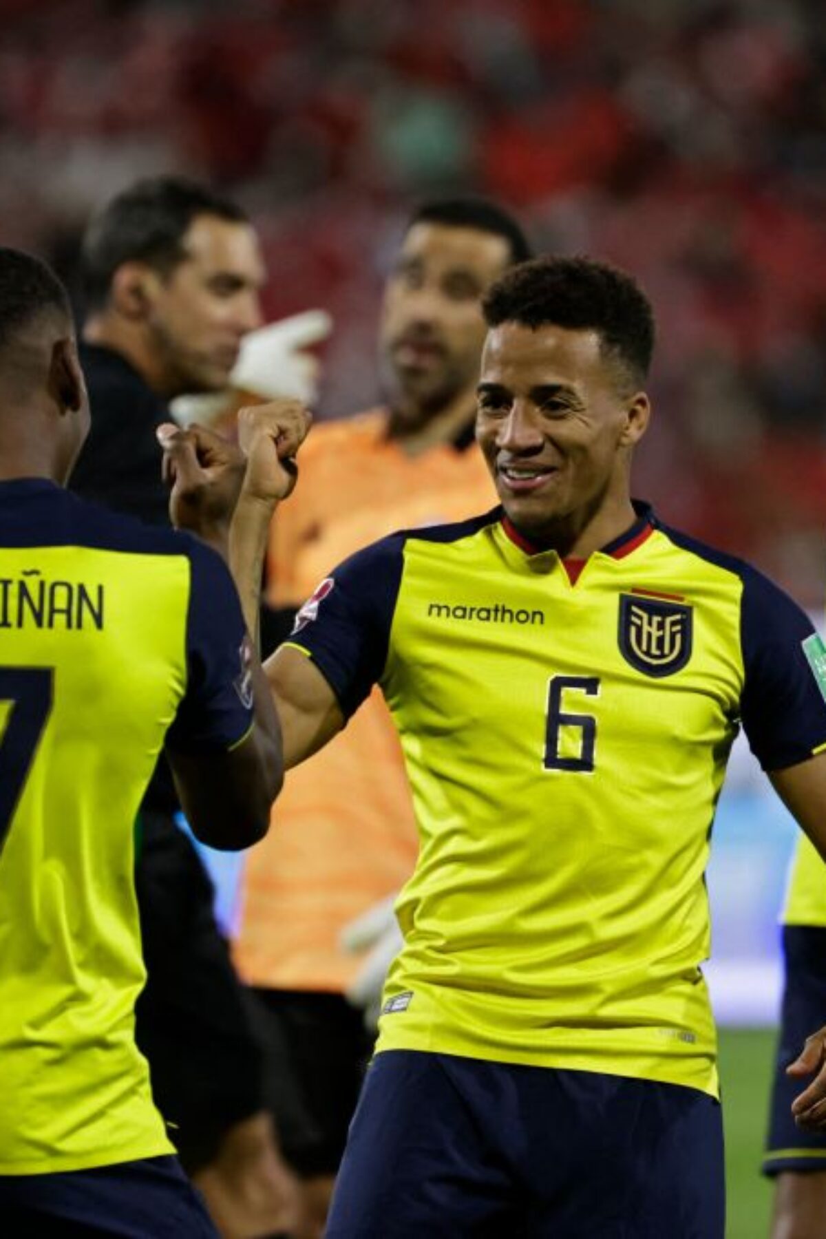 Ecuador's Pervis Estupinan (L) celebrates with teammate Byron Castillo after scoring against Chile during their South American qualification football match for the FIFA World Cup Qatar 2022 at the San Carlos de Apoquindo stadium in Santiago, on November 16, 2021. (Photo by ALBERTO VALDES / POOL / AFP) (Photo by ALBERTO VALDES/POOL/AFP via Getty Images)