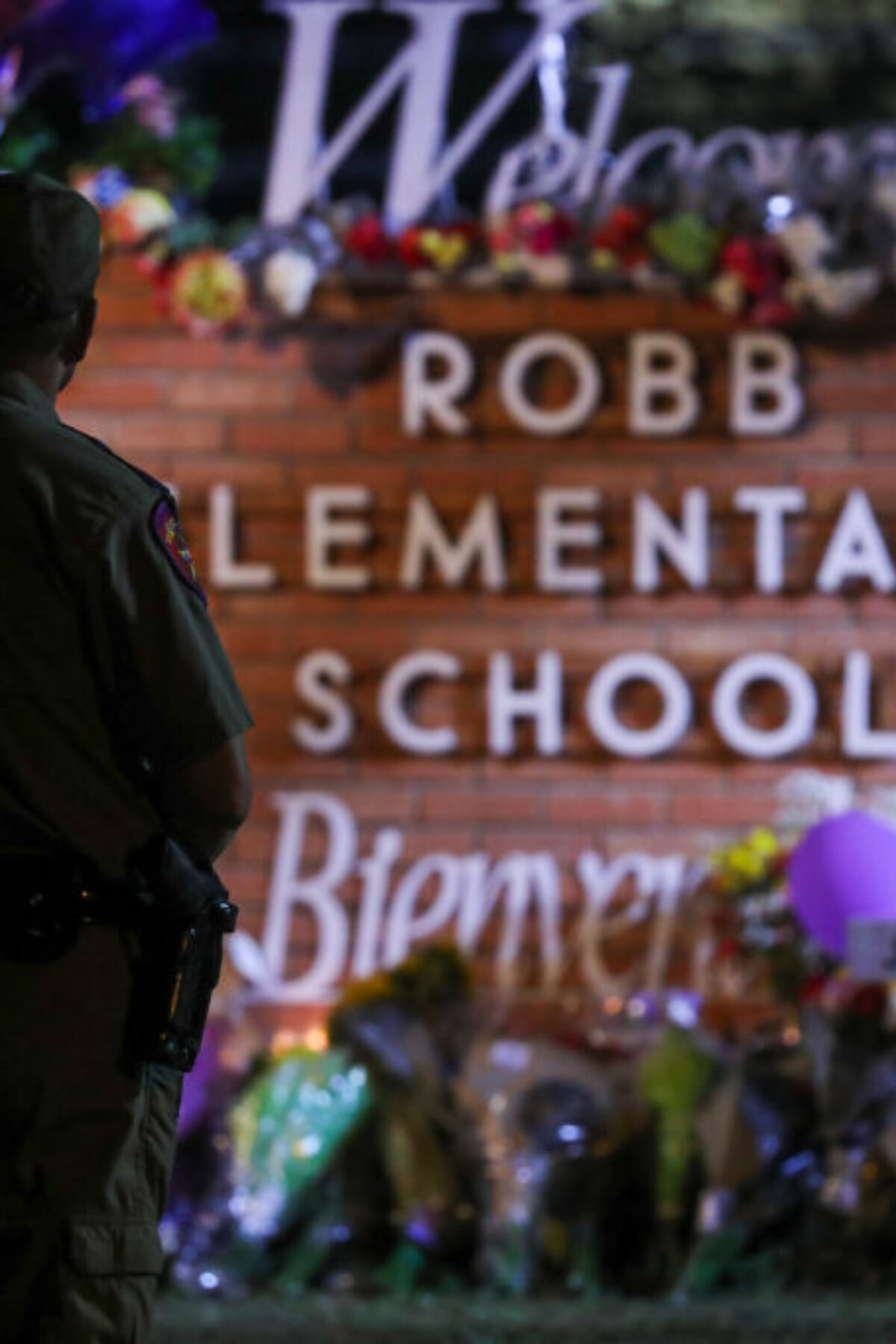 UVALDE,TEXAS, USA - MAY 25:Flowers are placed on a make shift memorial outside Robb Elementary School in Uvalde, Texas, on May 25, 2022. Texas state troopers outside Robb Elementary School 19 students and one teacher were killed during a massacre in a Texas elementary school, the deadliest US school shooting. (Photo by Yasin Ozturk/Anadolu Agency via Getty Images)