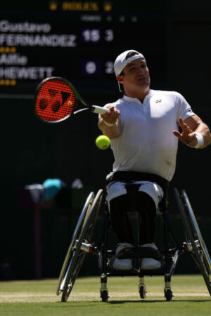 LONDON, ENGLAND - JULY 08: Gustavo Fernandez of Argentina plays a forehand against Alfie Hewett of Great Britain during their Wheelchair Singles Semi Final match on day twelve of The Championships Wimbledon 2022 at All England Lawn Tennis and Croquet Club on July 08, 2022 in London, England. (Photo by Julian Finney/Getty Images)