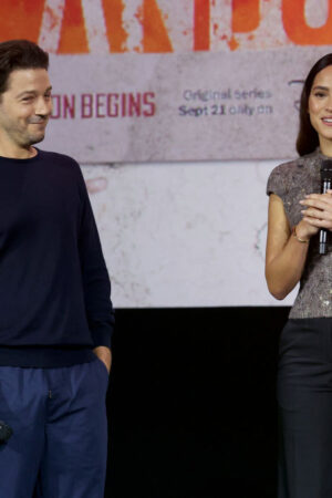 ANAHEIM, CALIFORNIA - SEPTEMBER 10: (L-R) Diego Luna and Adria Arjona speak onstage during D23 Expo 2022 at Anaheim Convention Center in Anaheim, California on September 10, 2022. (Photo by Jesse Grant/Getty Images for Disney)