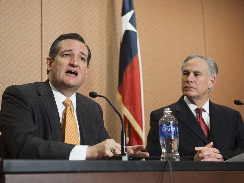 Republican Presidential hopeful and Texas Senator Ted Cruz (L) speaks alongside Texas Governor Greg Abbott about the Senate bill, 