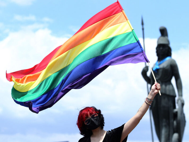 A person waves the rainbow flag, or pride flag, during the first in-person LGBT+ Pride march amid the novel coronavirus COVID-19 pandemic, in Guadalajara, Jalisco State, Mexico, on June 12, 2021. (Photo by Ulises RUIZ / AFP) (Photo by ULISES RUIZ/AFP via Getty Images)
