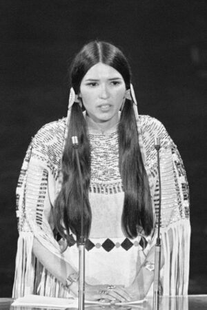 Sacheen Littlefeather (born Marie Louise Cruz, 1946 - 2022) speaks at the 45th Academy Awards. On behalf of Marlon Brando, she refused the Best Actor award he was awarded for his role in 'The Godfather'. Brando refused the award because of the treatment by the Americans of the American Indian.