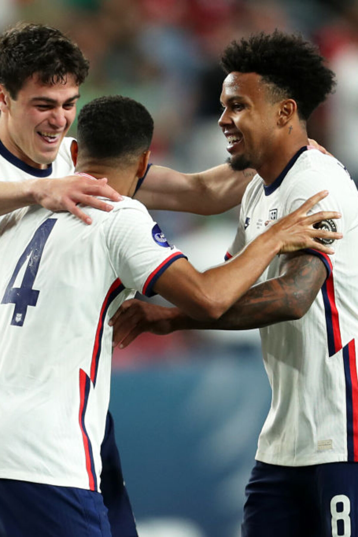 DENVER, CO - JUNE 06: Giovanni Reyna #7, Tyler Adams #4 and Weston McKennie #8 of United States celebrates after winning the CONCACAF Nations League Championship Final between United States and Mexico at Empower Field At Mile High on June 6, 2021 in Denver, Colorado. (Photo by Omar Vega/Getty Images)