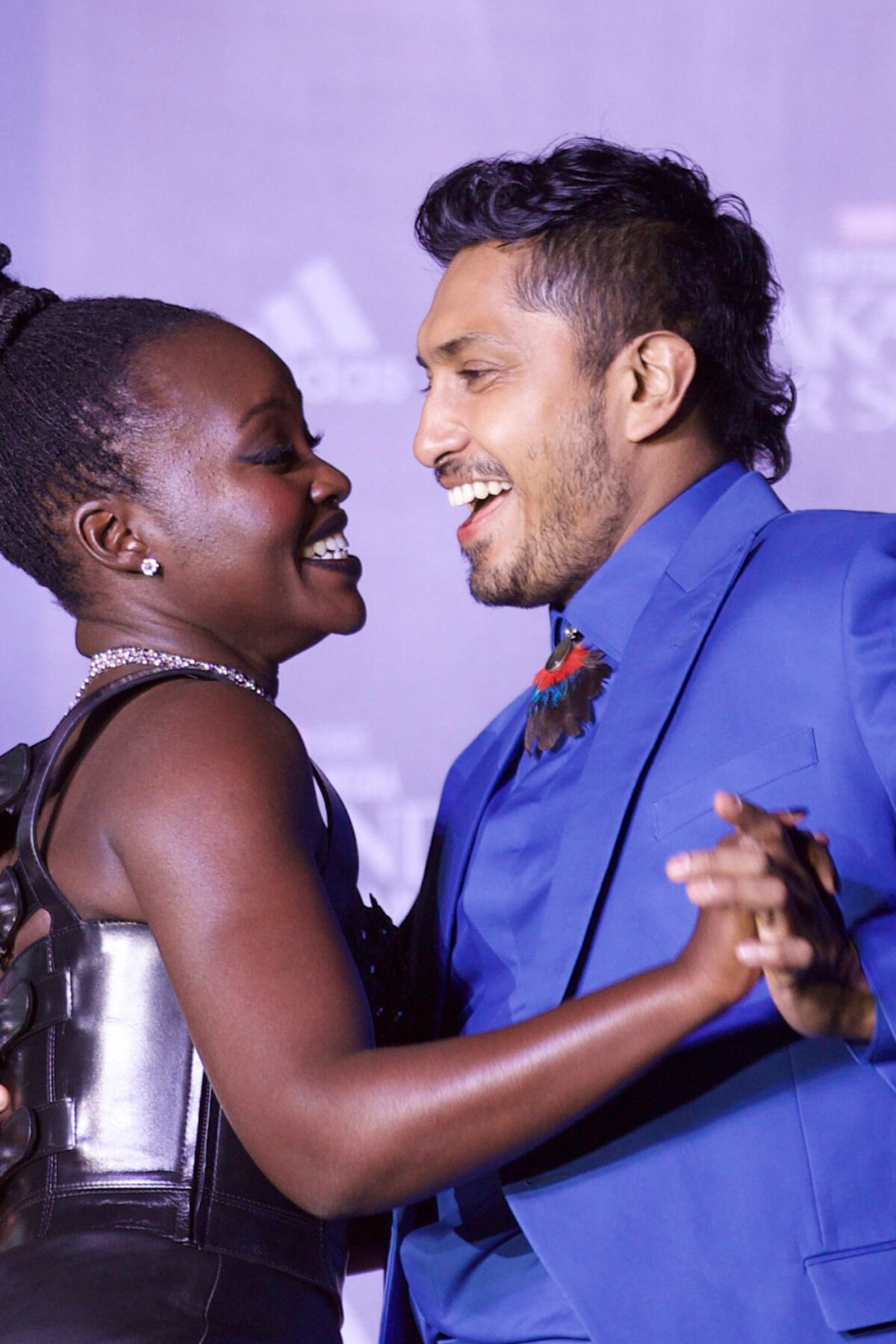 STATE OF MEXICO, MEXICO . NOVEMBER 9: Lupita Nyongo and Tenoch Huerta dance during the Black Panther: Wakanda Forever Fan Event at Plaza Satelite. On November 9, 2022 in State of Mexico, Mexico. (Photo credit should read Julian Lopez/ Eyepix Group/Future Publishing via Getty Images)