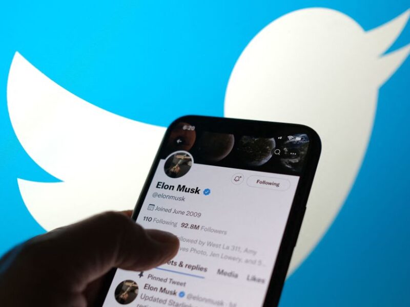 This illustration photo taken May 13, 2022, displays Elon Musks Twitter account with a Twitter logo in the background in Los Angeles. - Elon Musk sent mixed messages Friday about his proposed Twitter acquisition, pressuring shares of the microblogging platform amid skepticism on whether the deal will close. In an early morning tweet, Musk said the $44 billion takeover was 