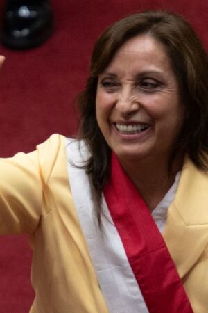 Peruvian Dina Boluarte greets members of the Congress after being sworn in as the new President hours after former President Pedro Castillo was impeached in Lima, on December 7, 2022. - Peru's Pedro Castillo was impeached and replaced as president by his deputy on Wednesday in a dizzying series of events in the country that has long been prone to political upheaval. Dina Boluarte, a 60-year-old lawyer, was sworn in as Peru's first female president just hours after Castillo tried to wrest control of the legislature in a move criticised as an attempted coup. (Photo by Cris BOURONCLE / AFP) (Photo by CRIS BOURONCLE/AFP via Getty Images)