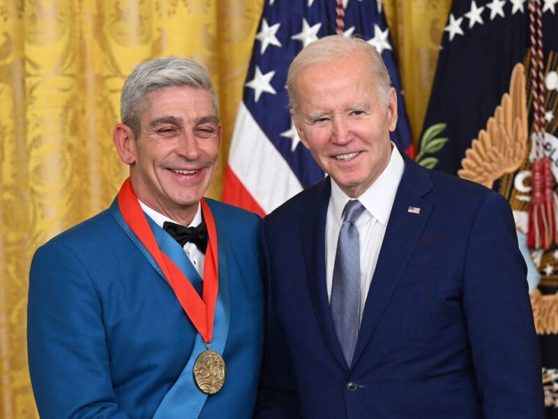 US President Joe Biden awards poet Richard Blanco with the 2021 National Humanities Medal during a ceremony in the East Room of the White House in Washington, DC, March 21, 2023. (Photo by SAUL LOEB / AFP) (Photo by SAUL LOEB/AFP via Getty Images)