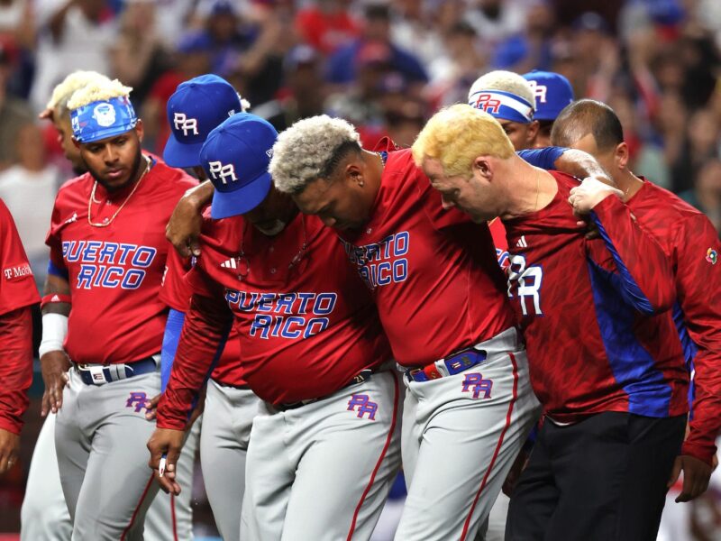 MIAMI, FLORIDA - MARCH 15: Edwin Diaz #39 of Team Puerto Rico is carried off the field after sustaining an injury while celebrating a 5-2 win against Team Dominican Republic during their World Baseball Classic Pool D game at loanDepot park on March 15, 2023 in Miami, Florida. (Photo by Al Bello/Getty Images)