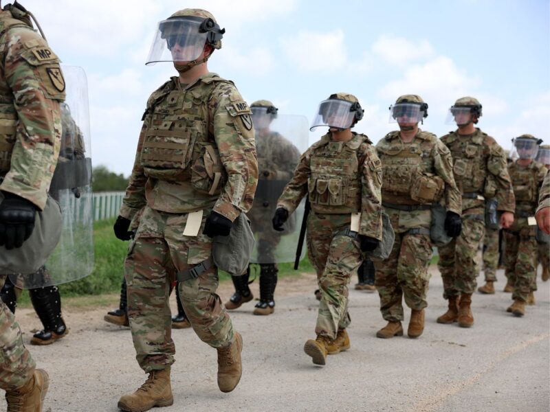 BROWNSVILLE, TEXAS - MAY 10: Members of the Texas National Guard are deployed to an area of high migrant crossings along the United States border with Mexico on May 10, 2023 in Brownsville, Texas. A surge of immigrants is expected with the end of the U.S. government's Covid-era Title 42 policy, which for the past three years has allowed for the quick expulsion of irregular migrants entering the country. More than 29,000 individuals are in U.S. Customs and Border Protection custody, including nearly 18,000 in the last 24 hours. (Photo by Joe Raedle/Getty Images)