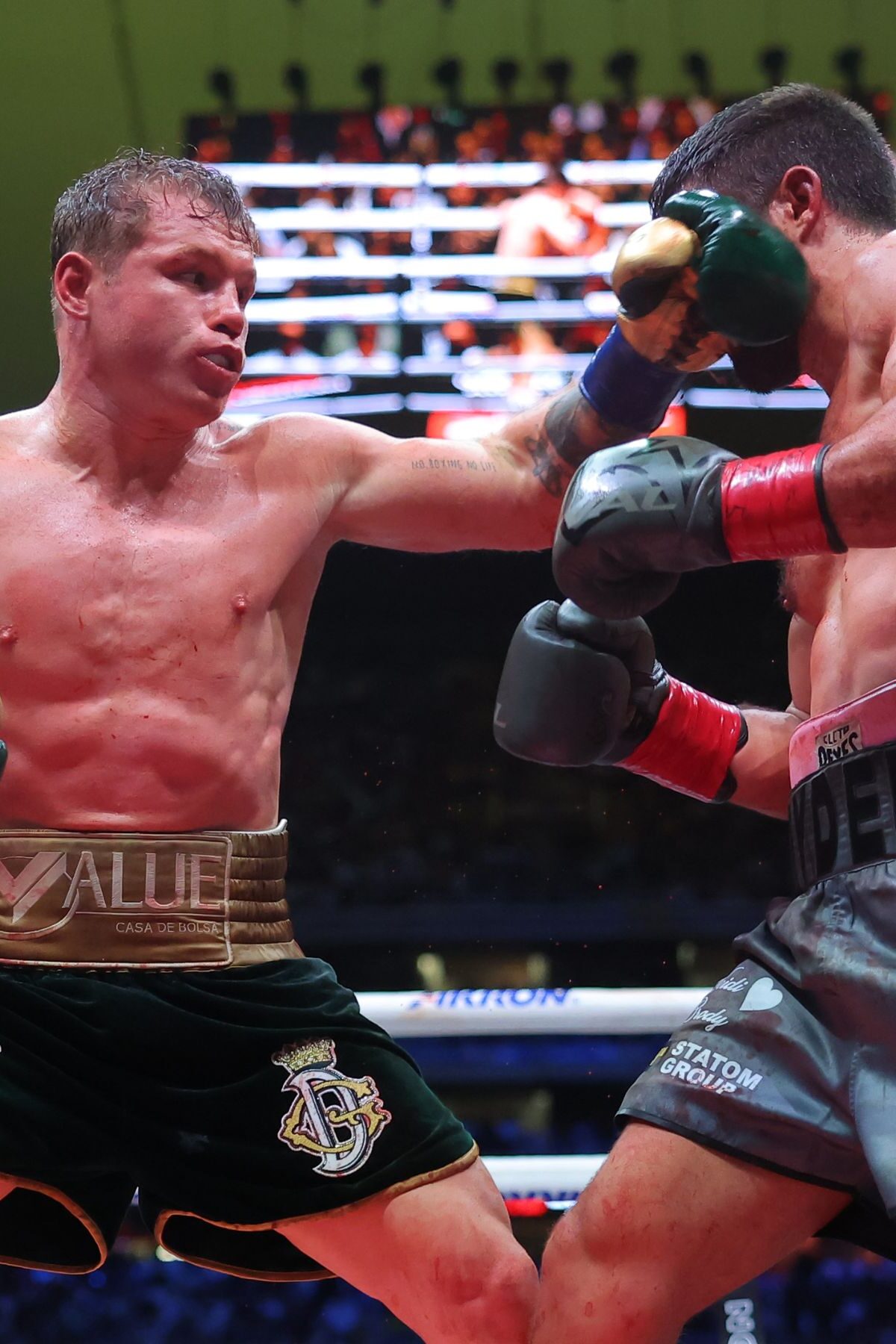 ZAPOPAN, MEXICO - MAY 06: Canelo Alvarez of Mexico punches John Ryder of Great Britain during the fight for the Super Middleweight Championship at Akron Stadium on May 06, 2023 in Zapopan, Mexico. (Photo by Hector Vivas/Getty Images)