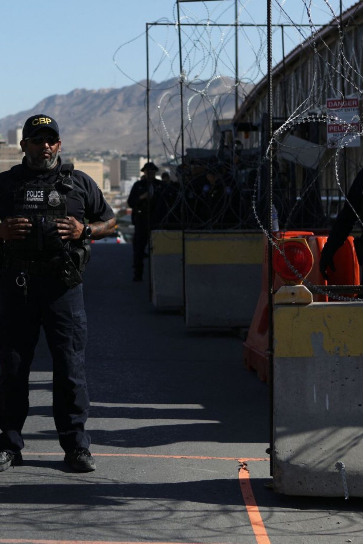 US Customs and Border Protection agents guard the Paso del Norte - Santa Fe International Bridge in Ciudad Juarez, Chihuahua state, Mexico that connects to El Paso, Texas on May 12, 2023. The United States bolted tough new immigration policies into place Friday, setting up an uncertain future for desperate migrants reaching its southern border as a top official expressed confidence the system will hold. Tens of thousands of people were expected to try to cross into the United States in coming days after it lifted pandemic-era rules, hoping to escape the poverty and criminal gangs wracking their own countries in what the United Nations called an 