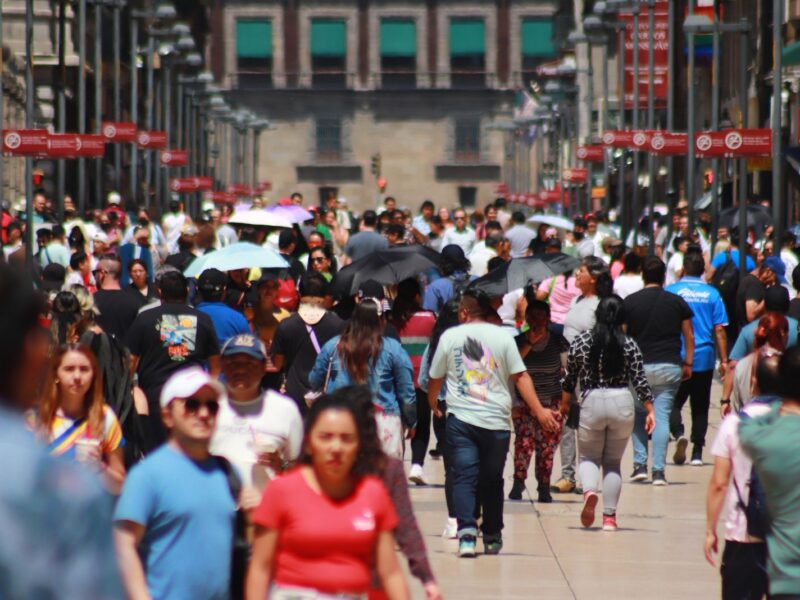 June 22, 2023 in Mexico City, Mexico: People protect themselves from the sun with umbrellas and quench their thirst with ice cream as they walk through the historic center, during the Orange Alert due to forecast high temperatures. (Photo credit should read Carlos Santiago / Eyepix Group/Future Publishing via Getty Images)