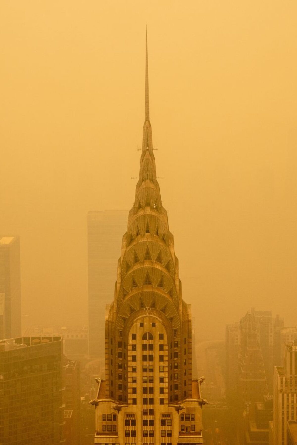 NEW YORK, NEW YORK - JUNE 7: Smoky haze from wildfires in Canada diminishes the visibility of the Chrysler Building on June 7, 2023 in New York City. New York topped the list of most polluted major cities in the world on Tuesday night, as smoke from the fires continues to blanket the East Coast. (Photo by David Dee Delgado/Getty Images)