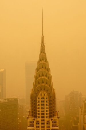 NEW YORK, NEW YORK - JUNE 7: Smoky haze from wildfires in Canada diminishes the visibility of the Chrysler Building on June 7, 2023 in New York City. New York topped the list of most polluted major cities in the world on Tuesday night, as smoke from the fires continues to blanket the East Coast. (Photo by David Dee Delgado/Getty Images)