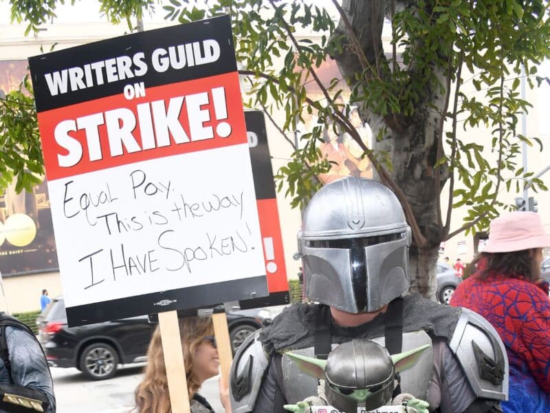BURBANK, CALIFORNIA - MAY 24: Guild members participate in the Writers Guild Of America Strike: Superhero Day held in front of Warner Bros. Studios on May 24, 2023 in Burbank, California. (Photo by Albert L. Ortega/Getty Images)