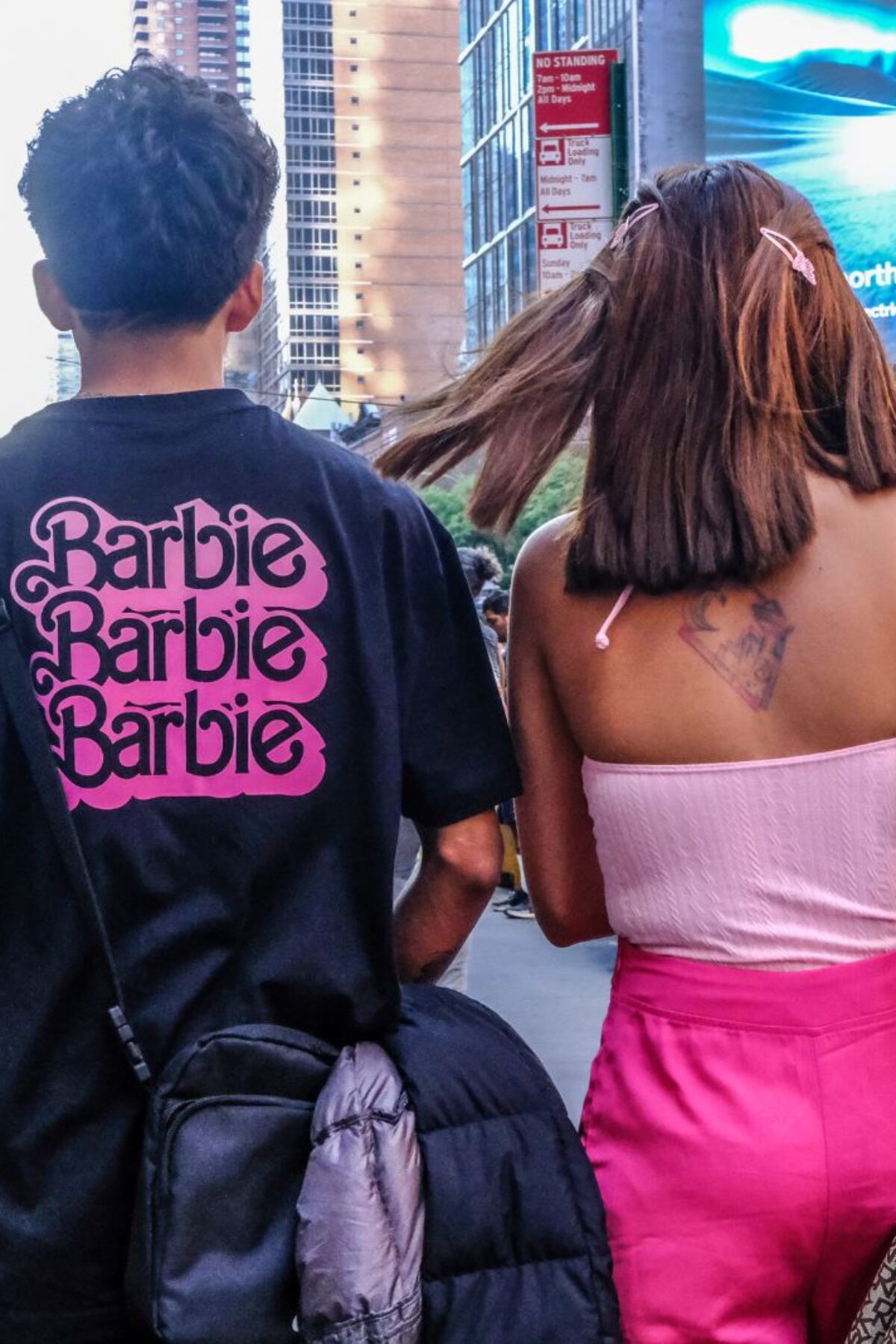 NEW YORK, NEW YORK - JULY 21: People dress up as the doll Barbie to attend the Barbie movie on July 21, 2023 in New York City. On the opening day, director Greta Gerwig's film 
