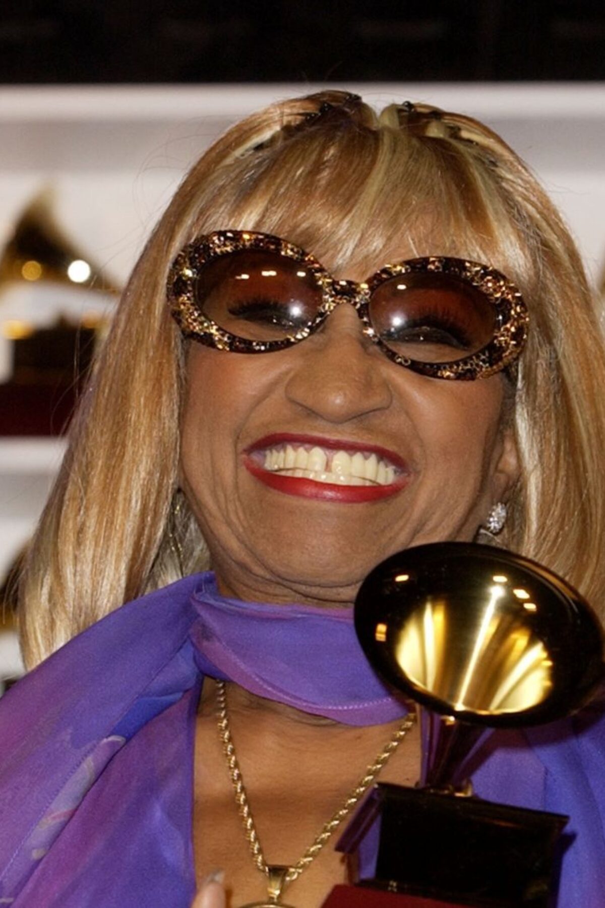 Quarters_Celia Cruz holds her GRAMMY for Best Traditional Tropical Album. (Photo by SGranitz/WireImage)