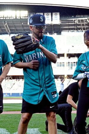 SEATTLE, WA - JULY 08: Marcello Hernandez #23, Yandel #150 and Natti Natasha #1 of Team Finch dance during the MLB All-Star Celebrity Softball Game presented by Corona at T-Mobile Park on Saturday, July 8, 2023 in Seattle, Washington. (Photo by Cheyenne Boone/MLB Photos via Getty Images)