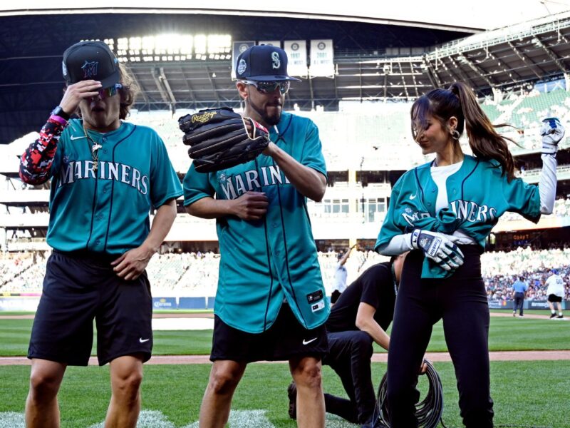 SEATTLE, WA - JULY 08: Marcello Hernandez #23, Yandel #150 and Natti Natasha #1 of Team Finch dance during the MLB All-Star Celebrity Softball Game presented by Corona at T-Mobile Park on Saturday, July 8, 2023 in Seattle, Washington. (Photo by Cheyenne Boone/MLB Photos via Getty Images)