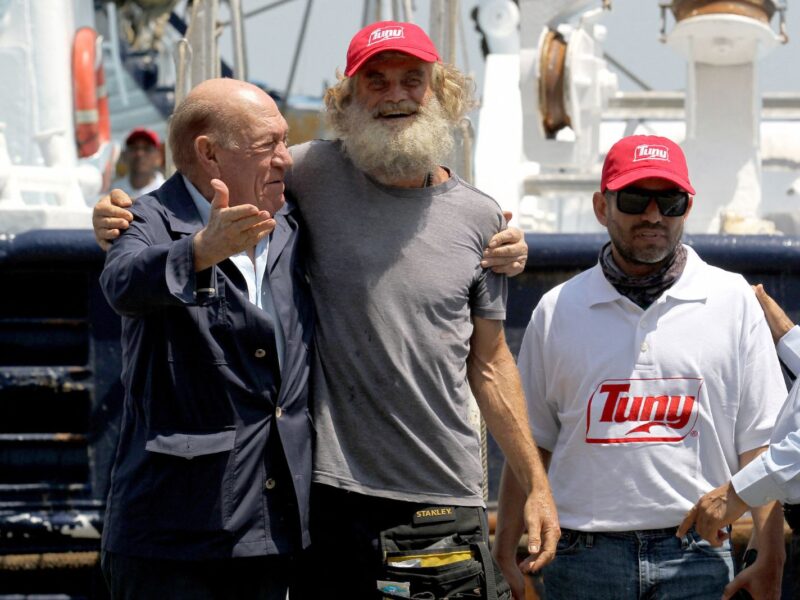 Australian sailor Tim Shaddock (2nd-L) poses for a picture after arriving at the port of Manzanillo, Colima State, on July 18, 2023. An Australian sailor rescued with his dog after more than two months adrift in the Pacific Ocean arrived in Mexico Tuesday, declaring, 