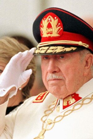 SANTIAGO, CHILE: General Augusto Pinochet salutes during a military parade in honor of his retirement as commander of the Chilean Army 06 March in Santiago. Pinochet was awarded the title of Meritorious Commander of the Army for Life. AFP PHOTO CRIS BOURONCLE (Photo credit should read CRIS BOURONCLE/AFP via Getty Images)