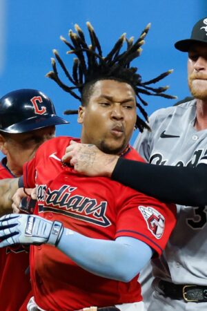 CLEVELAND, OH - AUGUST 05: Jose Ramirez #11 of the Cleveland Guardians is held by Michael Kopech #34 of the Chicago White Sox during a fight in the sixth inning at Progressive Field on August 05, 2023 in Cleveland, Ohio. (Photo by Ron Schwane/Getty Images)