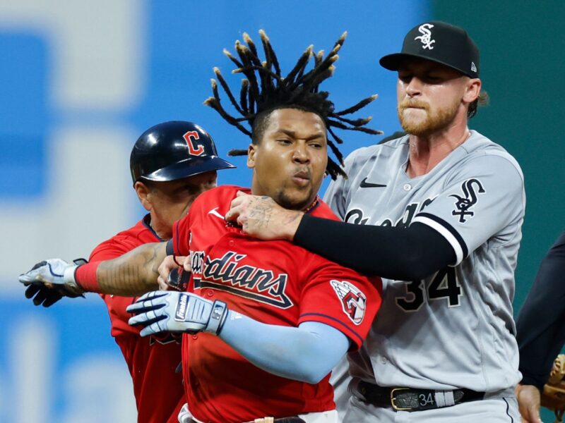 CLEVELAND, OH - AUGUST 05: Jose Ramirez #11 of the Cleveland Guardians is held by Michael Kopech #34 of the Chicago White Sox during a fight in the sixth inning at Progressive Field on August 05, 2023 in Cleveland, Ohio. (Photo by Ron Schwane/Getty Images)