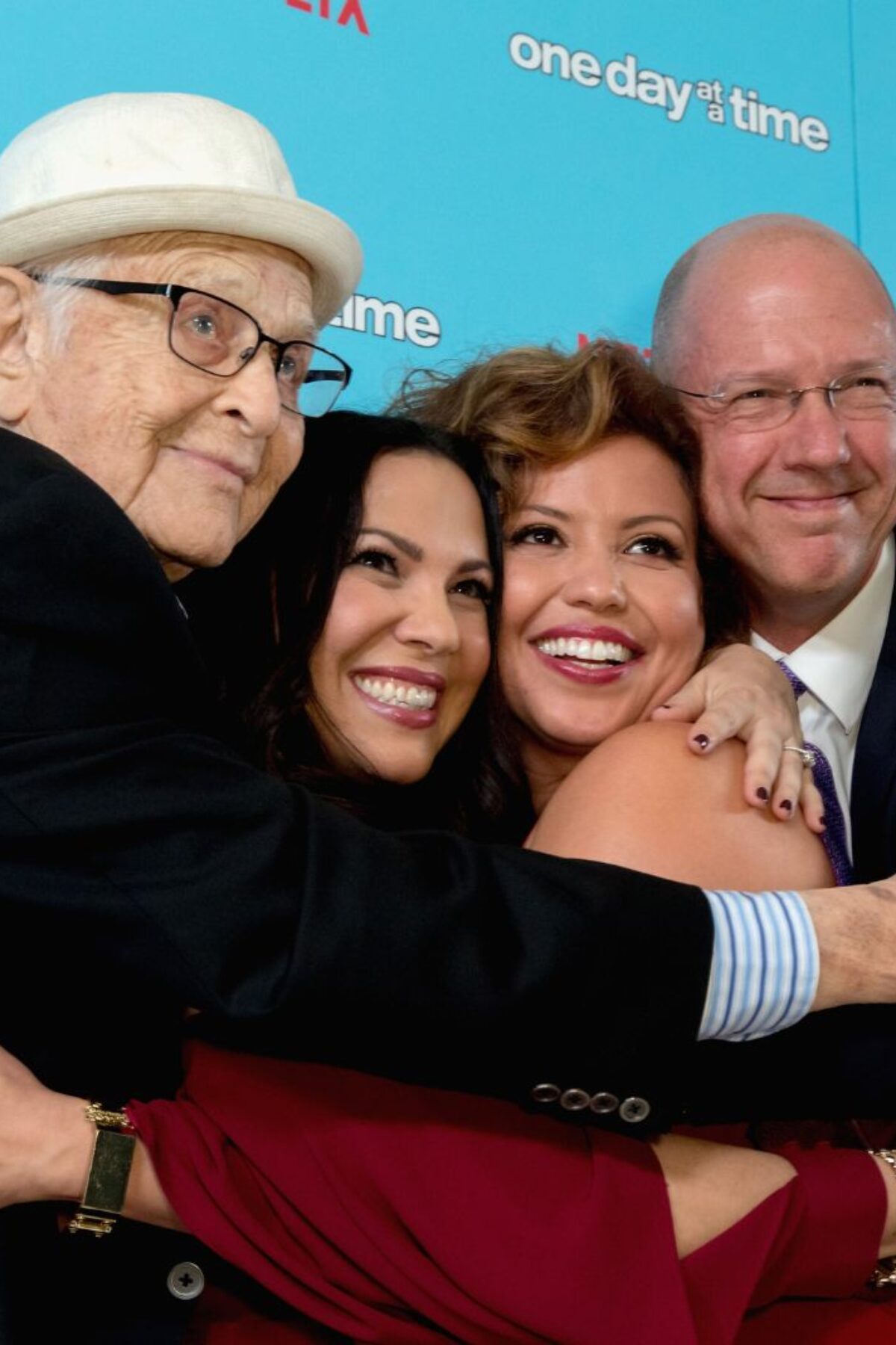 WEST HOLLYWOOD, CA - DECEMBER 14: (L-R) Executive producers Norman Lear and Gloria Calderon Kellett, actress Justina Machado and executive producer Mike Royce arrive for the Premiere Of Netflix's 