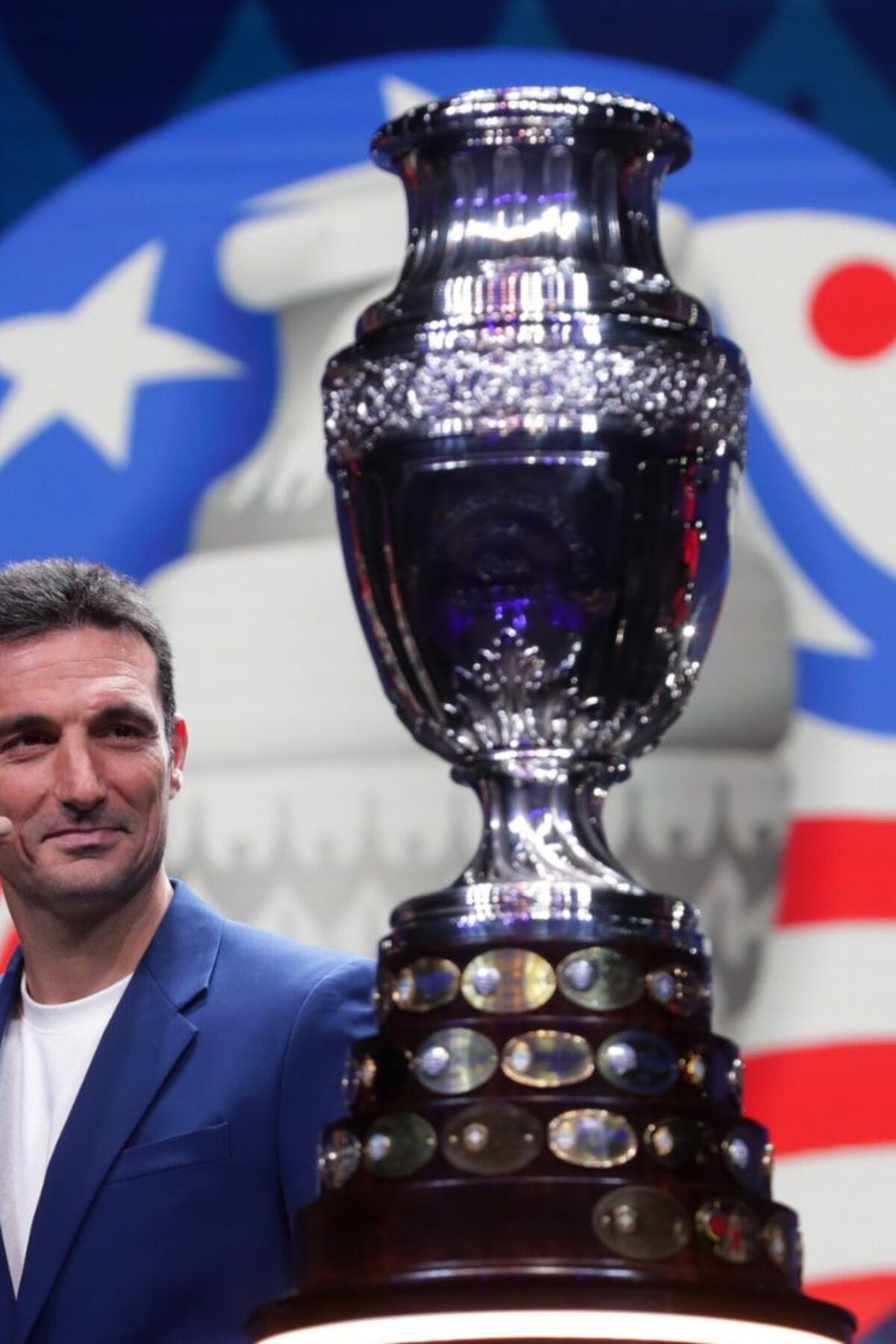 MIAMI, FLORIDA - DECEMBER 07: Lionel Scaloni, Head Coach of Argentina, presents the Copa America trophy during the official draw of CONMEBOL Copa América 2024 at James L. Knight Center on December 07, 2023 in Miami, Florida. (Photo by Gustavo Pagano/Getty Images)