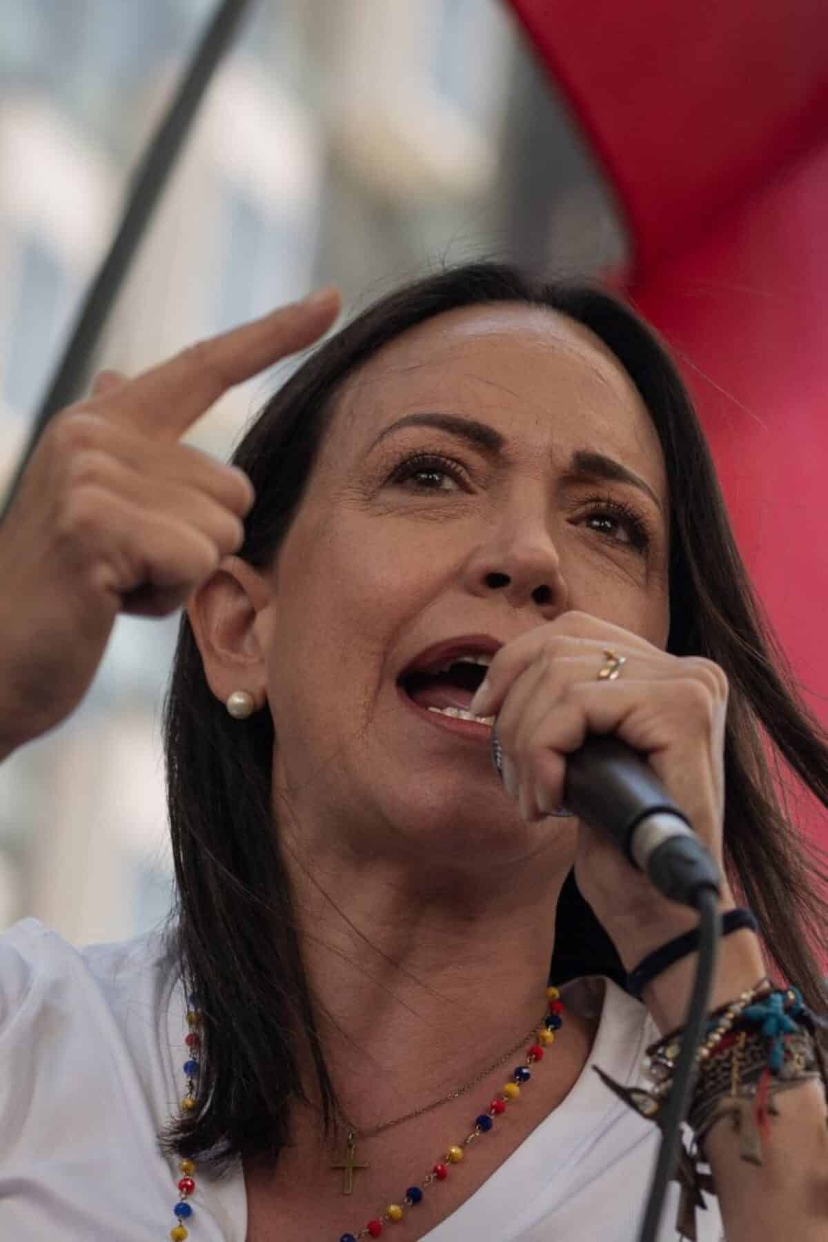 Venezuelan opposition leader María Corina Machado speaks to supporters during a demonstration on the anniversary of the 1958 uprising that overthrew a military dictatorship, at the Altamira square in Caracas on January 23, 2024. Venezuelan opposition leader Maria Corina Machado, who aspires to participate in this year's presidential elections despite being politically disqualified, denounced this Tuesday that her party headquarters appeared with graffiti alluding to a recent 