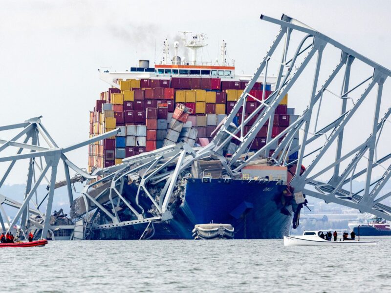 BALTIMORE, MARYLAND - MARCH 26: The cargo ship Dali sits in the water after running into and collapsing the Francis Scott Key Bridge on March 26, 2024 in Baltimore, Maryland. According to reports, rescuers are still searching for multiple people, while two survivors have been pulled from the Patapsco River. A work crew was fixing potholes on the bridge, which is used by roughly 30,000 people each day, when the ship struck at around 1:30am on Tuesday morning. The accident has temporarily closed the Port of Baltimore, one of the largest and busiest on the East Coast of the U.S. (Photo by Tasos Katopodis/Getty Images)