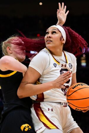 CLEVELAND, OHIO - APRIL 7: Kamilla Cardoso #10 of the South Carolina Gamecocks spins around a defender against the Iowa Hawkeyes during the NCAA Women's Basketball Tournament National Championship at Rocket Mortgage Fieldhouse on April 7, 2024 in Cleveland, Ohio. (Photo by Ben Solomon/NCAA Photos via Getty Images)